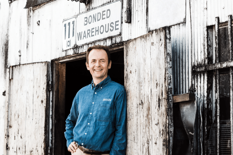 Conor at and old Heaven Hill Distillery ware house